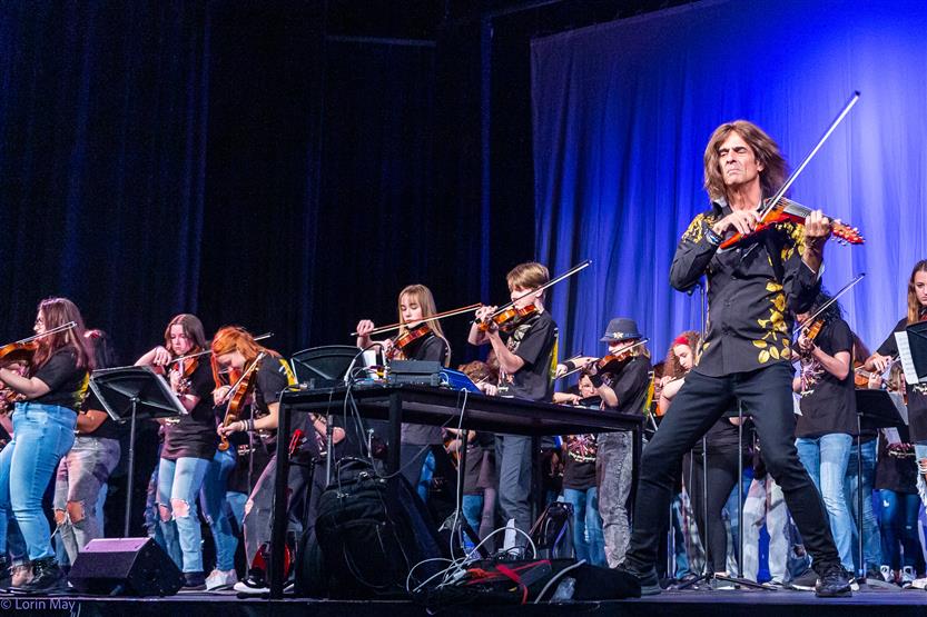 Orchestra students perform onstage